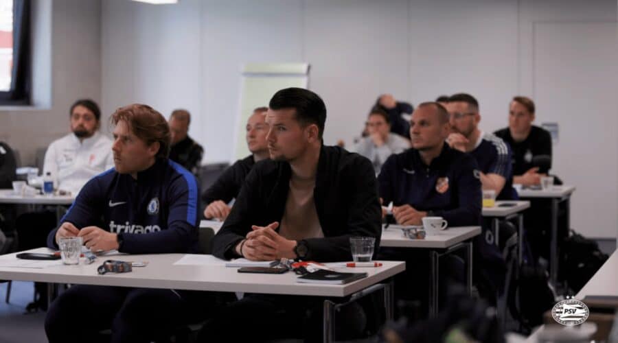 Participating coaches seated during a theoretical session at PSV Eindhoven Interest Days coaching course.